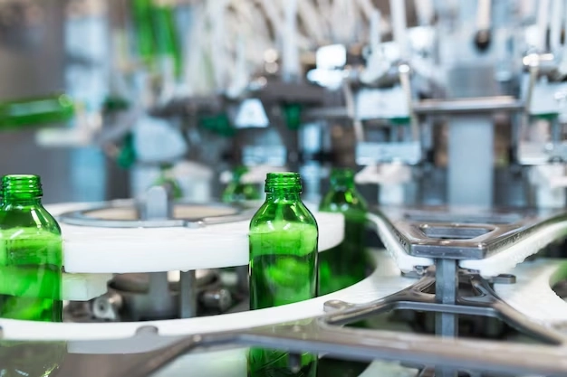 water-factory-water-bottling-line-processing-bottling-pure-mineral-water-into-small-green-glass-bottles-selective-focus_473712-550